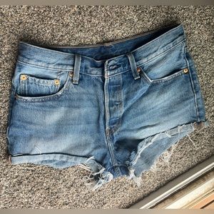 Gently used Levi’s 501 cutoff denim shorts, size 28.